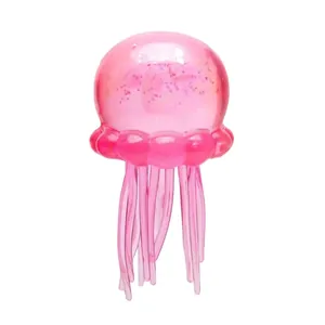 Pink gradient jellyfish squishy toy with internal glitter for stress relief