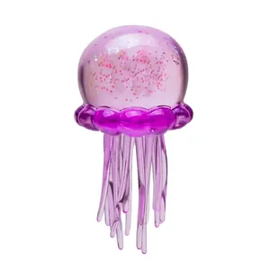 Detail showing a purple translucent jellyfish squeeze toy with shiny inner glitter