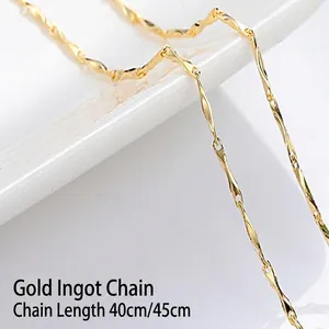 Detailed macro view of a 14K gold-plated yuanbao style necklace chain in shiny gold