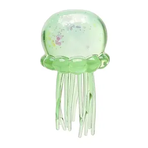 Close-up detail of green translucent jellyfish squeeze toy with colorful glitters
