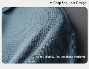 Close-up detail showing the premium textured knit and shoulder stitching of a blue polo shirt