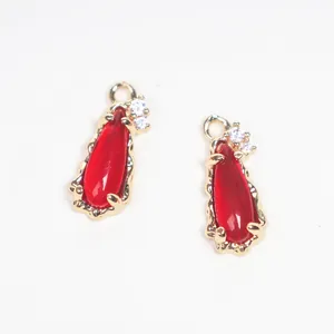 Elegant red teardrop glass pendant with copper zircon bezel for DIY jewelry making.