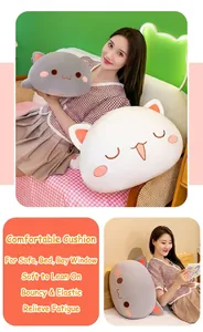 Detail view showing soft peach cat plush pillows used as comfortable back cushions in bed