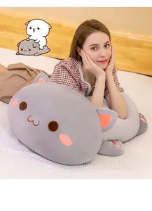 Soft grey cat plush body pillow for sleeping and napping shown in bedroom setting