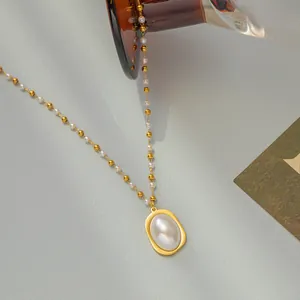 Elegant gold plated stainless steel necklace with oval pearl pendant and bead chain