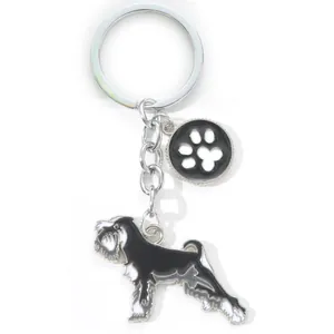 Detailed view of a black and white zinc alloy Schnauzer dog keychain with a cute paw charm