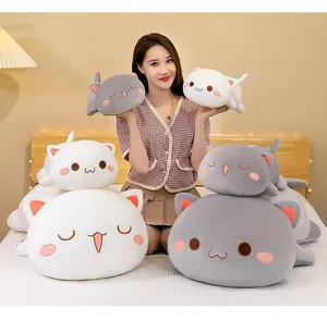 Asian model holding various sizes of cute white and grey Peach Cat plush pillows