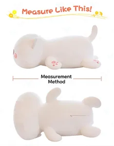 Detail view of a plush white cat pillow showing the correct length measurement method.