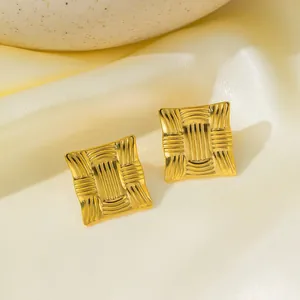 Detailed view of gold geometric textured square stud earrings in 304 stainless steel