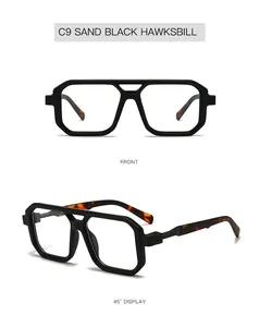 Detail view of double-bridge square sunglasses in sand black and hawksbill finish