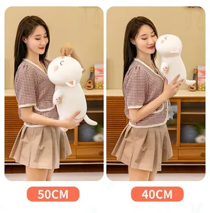 White cat plush pillow comparison in 40cm and 50cm sizes shown by an Asian model