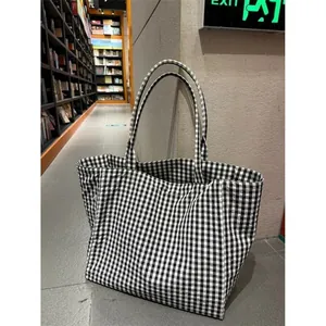 Minimalist black and white gingham large capacity tote bag for daily commute and casual style.