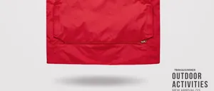 Close-up detail of the durable red fabric and zipper on a multi-pocket outdoor work vest