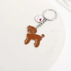 Close-up of brown poodle zinc alloy keychain with I Love Dogs tag