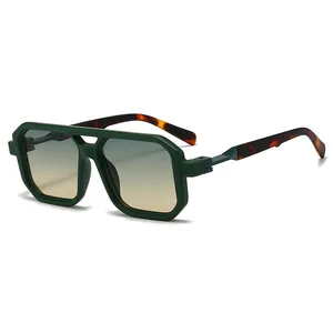 Modern double-bridge sunglasses with dark green frames and gradient lenses.
