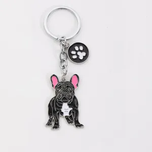 Detailed view of the French Bulldog zinc alloy keychain with a paw print charm