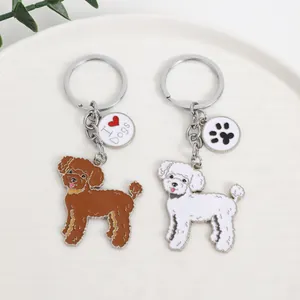 Poodle dog keychain set made of zinc alloy with heart and paw charms for bags.