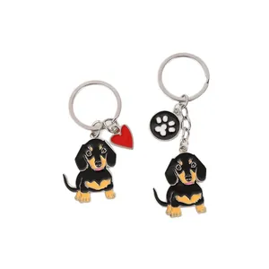 Cute zinc alloy dachshund dog keychain set featuring red heart and paw print charms