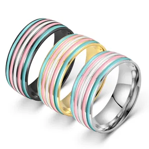 Set of three stainless steel rings with blue, pink, and white enamel stripes