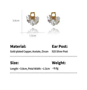 Detail view of white petal earrings showing 3.8cm length and material specs