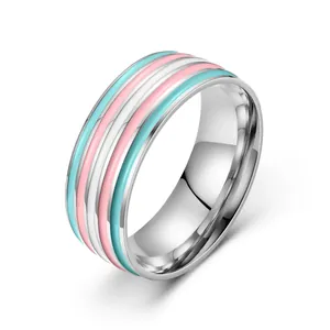 Stainless steel transgender pride ring with blue pink and white striped oil dripping