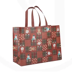 Detailed view of a festive Christmas non-woven gift bag with Santa and reindeer prints