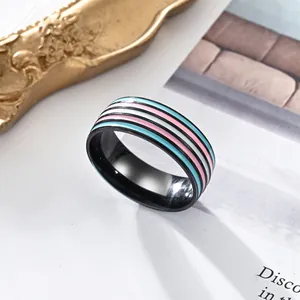 Stainless steel transgender pride ring with blue pink white stripes on black band