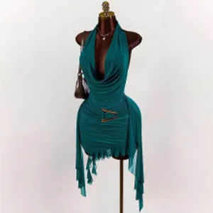 Detailed view of a teal halter-neck backless dress featuring a metallic waist buckle