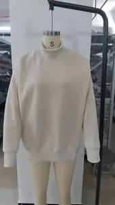 Detailed front view of women's thick mock neck oversized cream sweatshirt on a mannequin