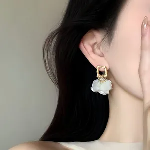 French style gold petal pearl dangle earrings for women with minimalist design