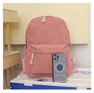 Close-up of a pink corduroy school backpack featuring soft textured fabric for students