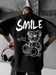 Back detail of black oversized T-shirt with white gothic bear and SMILE print