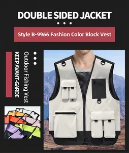 Detailed view of white and black multi-pocket fishing vest with D-rings and utility bags