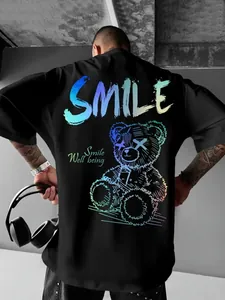 Detail view of black gothic t-shirt featuring vibrant colorful bear print and SMILE text.