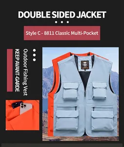 Detailed view of light blue multi-pocket outdoor fishing vest with mountain backdrop