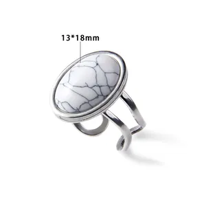 Detailed macro view of a silver ring featuring an oval white turquoise stone sized 13x18mm