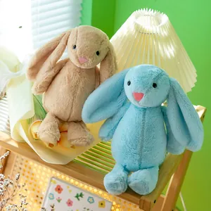 Soft plush bunny rabbit toys in beige and light blue with long floppy ears and pink nose