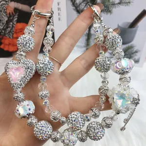 Luxury handcrafted beaded phone strap with rhinestone beads and crystal hearts.