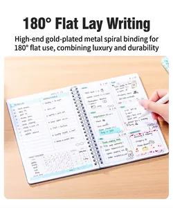 Detailed view of an open 52-week English planner with metallic spiral binding