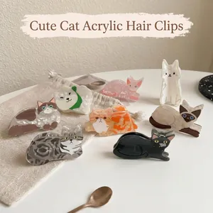 Detailed view of cute cat-shaped acrylic hair claw clips in various colors and breeds.