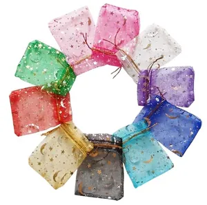 Colorful organza drawstring gift bags featuring gold foil star and moon pattern designs