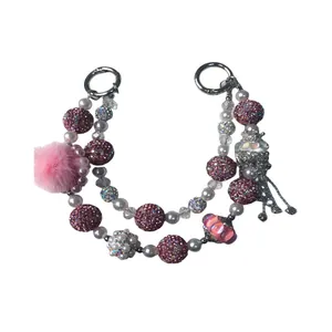 Handmade pink beaded phone charm with jellyfish pendant and pom-pom