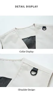 Close-up detail of a beige multi-pocket work vest neckline and shoulder D-ring hook.