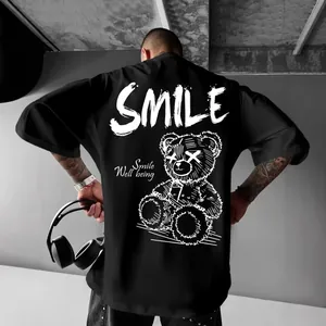 Oversized black streetwear T-shirt for men featuring a gothic bear print and SMILE slogan on back.