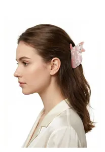 Side view of cute pink marbled cat-shaped hair claw clip on model's hair