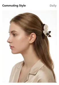 Side view of a female model wearing a cute Siamese cat-shaped acetate hair claw clip
