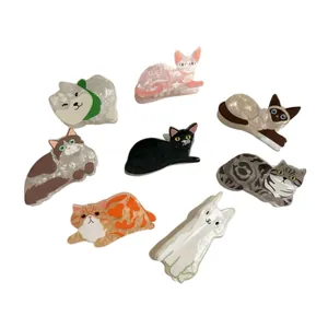 Selection of cute cat and dog shaped hair claw clips made of marbled acetate resin