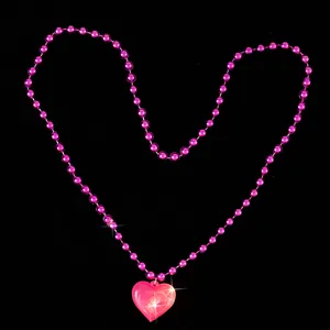 Glowing pink beaded necklace with LED light-up heart pendant for Valentine's Day