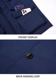 Detail view showing large pockets and back D-ring hook on navy blue utility vest.