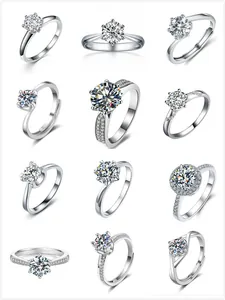 Multiple styles of silver moissanite rings featuring 1-carat round brilliant stones